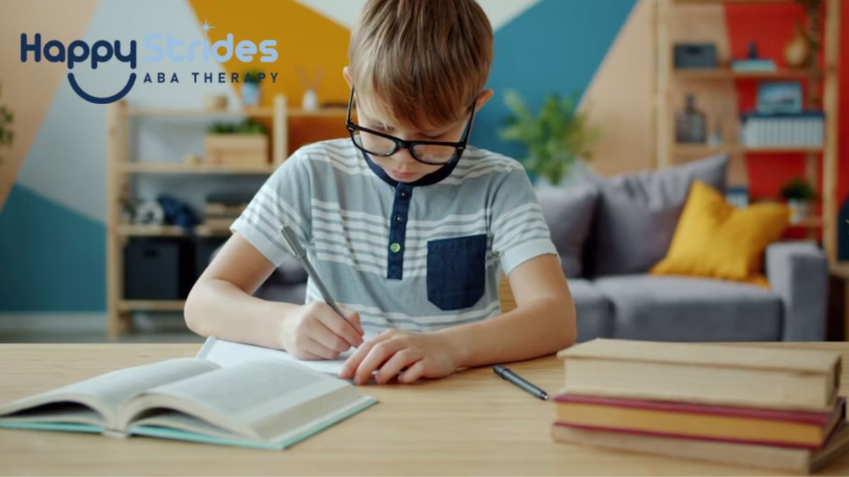 Autism intelligence, a boy works in his notebook, looking focused and deeply engaged.
