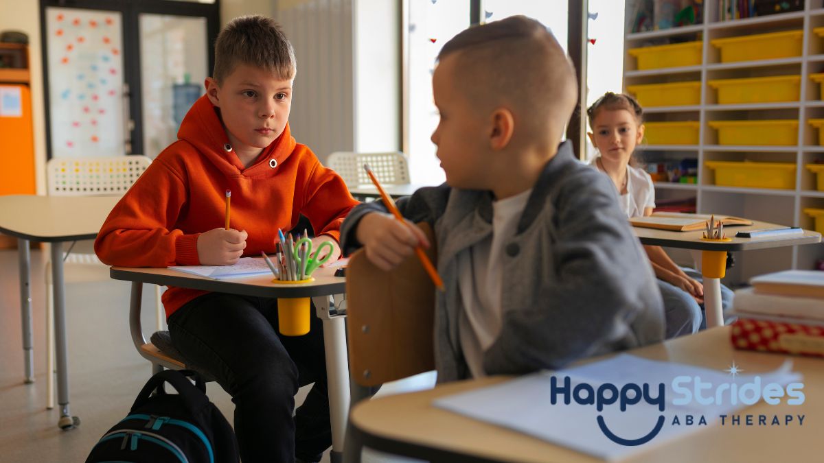 In an autism classroom, a boy twists his body to speak with a classmate at the back.