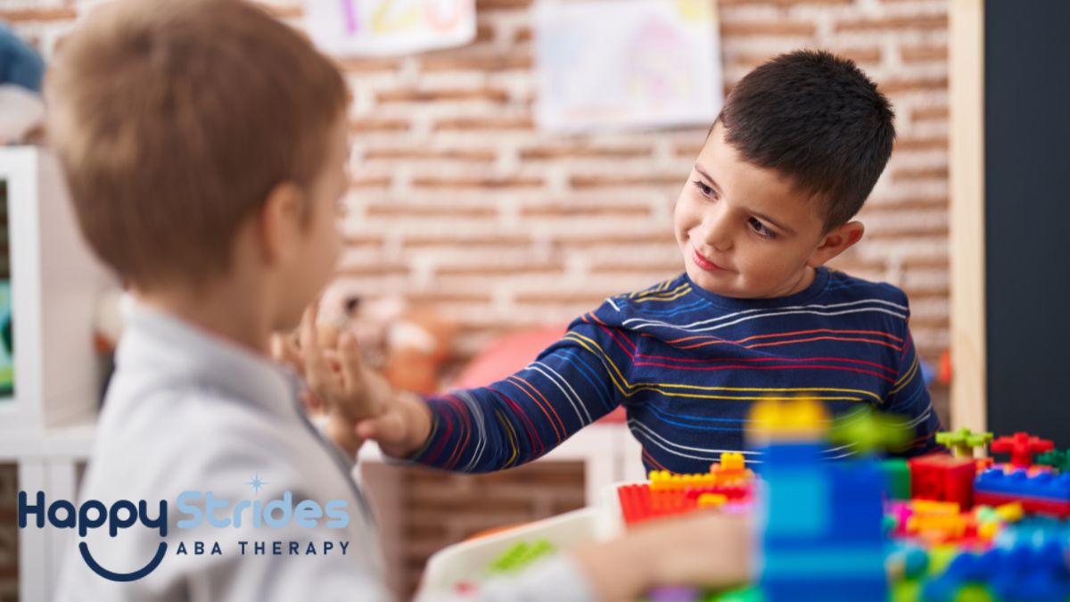 Two boys in a classroom analyzing their puzzle pieces, illustrating a learning activity.