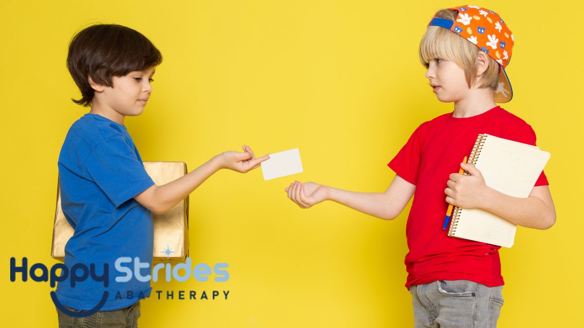 Two children pleasantly exchange item tokens in a yellow room, showing cooperation and positive interaction.