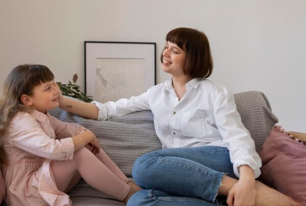 Child receives guidance from a parent about bedtime routines in a calm home setting.