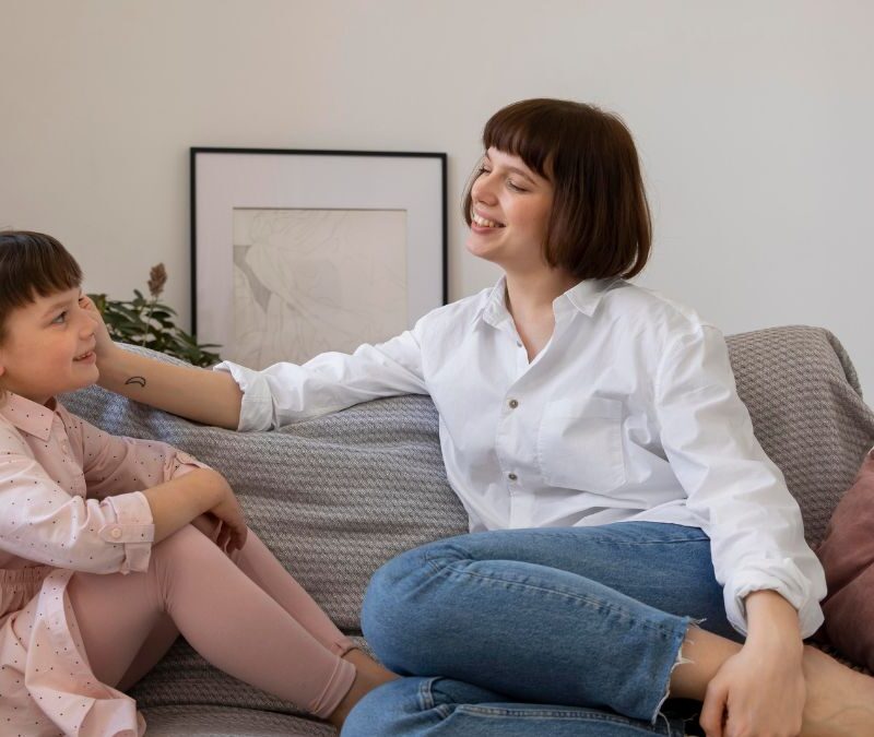Child receives guidance from a parent about bedtime routines in a calm home setting.
