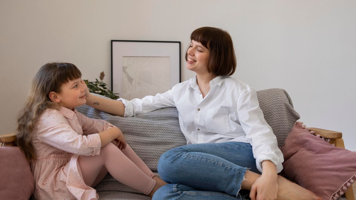 Child receives guidance from a parent about bedtime routines in a calm home setting.